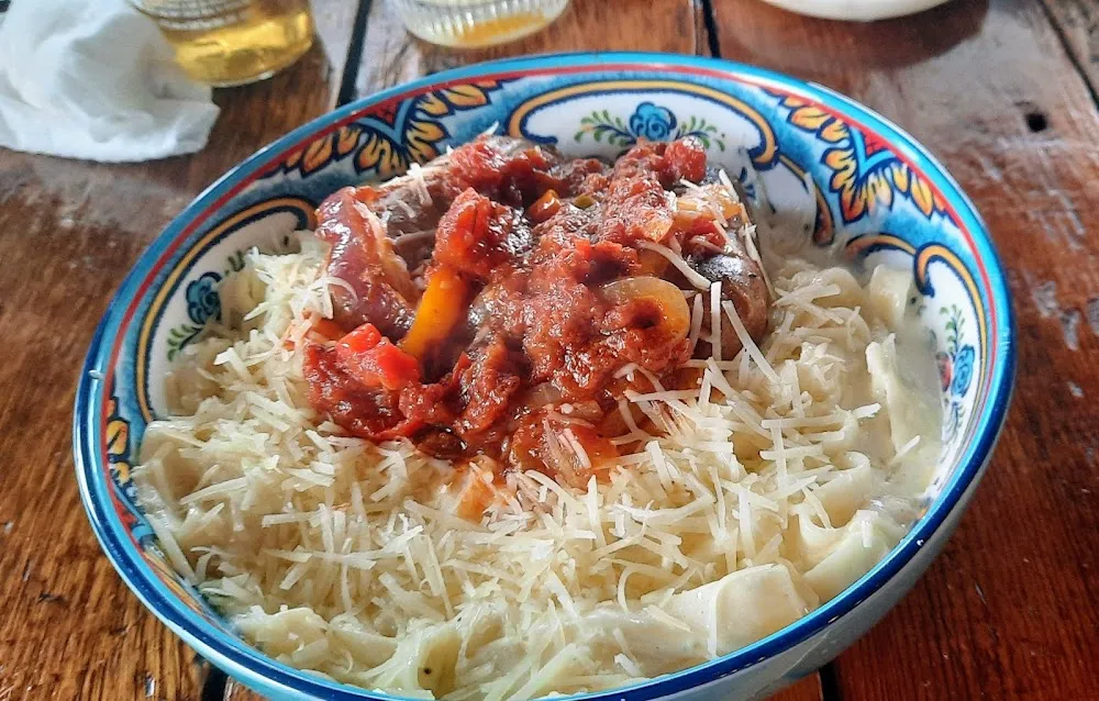 The Godfather Sausage and Peppers over Linguine Alfredo